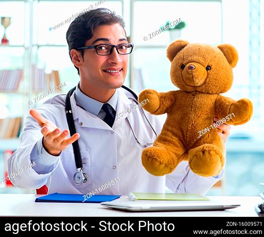 The pediatrician with toy sitting in the office