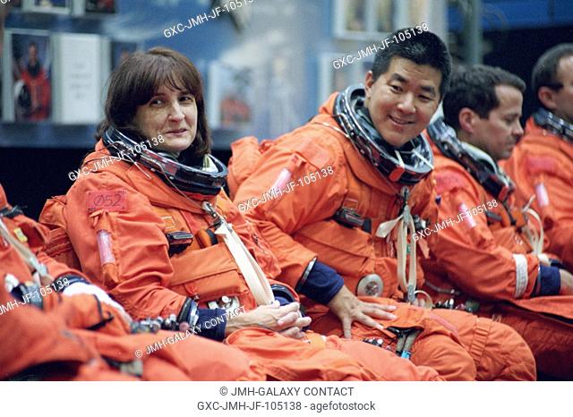 Astronauts Linda M. Godwin (left) and Daniel M. Tani, both STS-108 mission specialists, and Daniel W. Bursch and Carl E. Walz