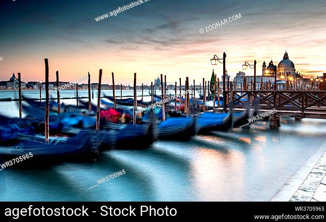 Venice Gondolas moored at the San Marco square or Piazza san Marco, and the San Giorgio Maggiore island at the back