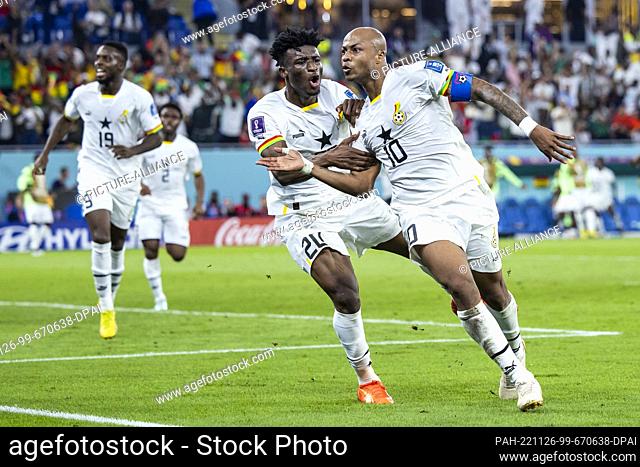 24 November 2022, Qatar, Doha: Soccer: World Cup, Portugal - Ghana, Preliminary Round, Group H, Matchday 1, Stadium 974, Ghana's André Ayew (r) cheers with...