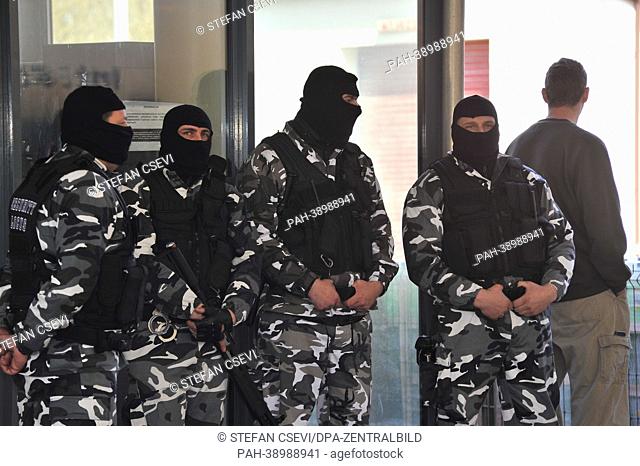 Men wearing masks and armed with machine guns occupy a gas station on the German-Polish border in Krajnik-Dolny, Poland, 21 April 2013