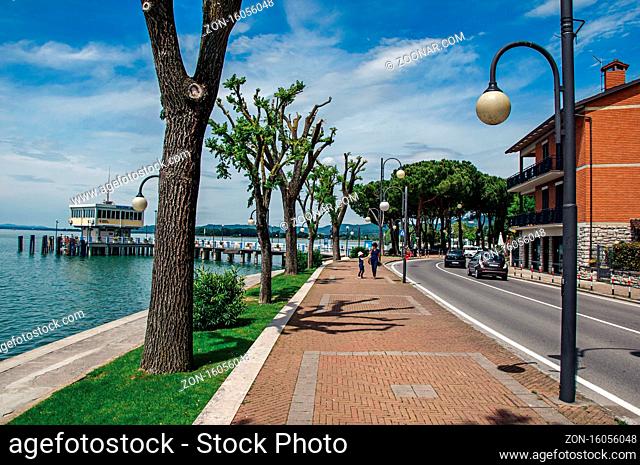 Passignano sul Trasimeno, Italy - May 15, 2013. View of the village and its harbor on the shores of Lake Trasimeno, a quiet and picturesque lake near Perugia