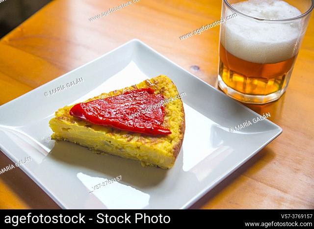 Spanish omelet with Piquillo pepper and glass of beer. Spain
