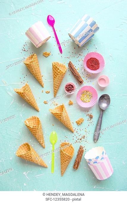 Ice cream cones, containers and sprinkles for ice cream