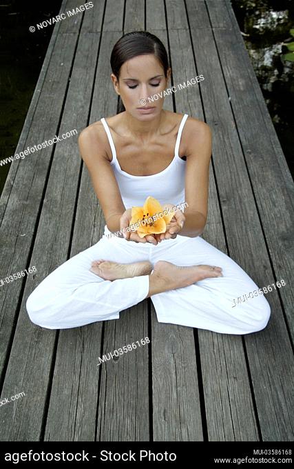 Woman doing yoga in a garden