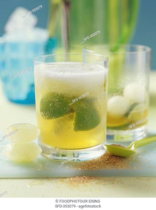 Two glasses of caipirinha punch with melon balls