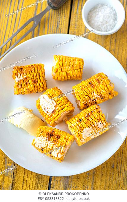 Grilled corn on the white plate