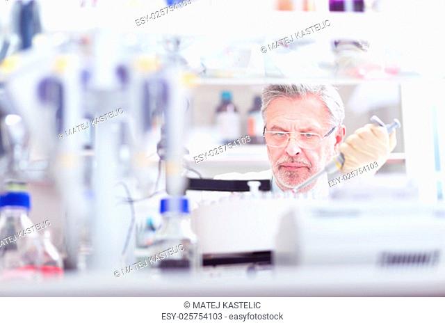 Life scientist researching in laboratory. Life sciences study living organisms on the level of microorganisms, viruses, human, animal and plant cells, genes
