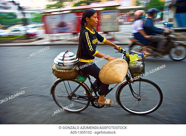 People in bicicle. Ho Chi Minh City (formerly Saigon). South Vietnam