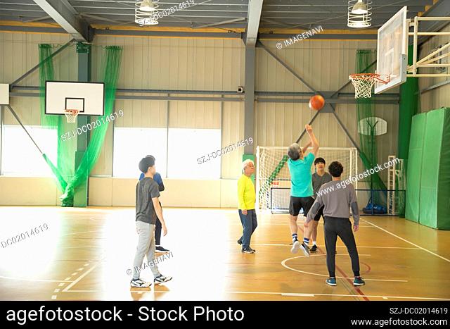 Senior and young people enjoying basket ball