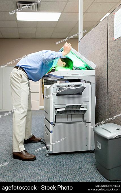 Man photocopying his head