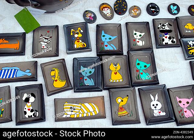 childrens playful small ceramic images with convivial dogs, cats, mice and dragons