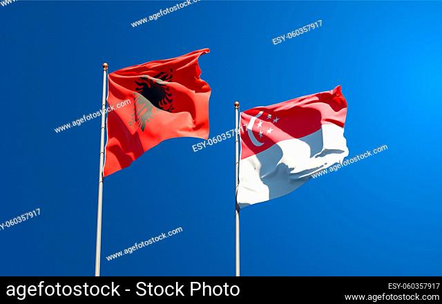 Beautiful national state flags of Singapore and Albania together at the sky background. 3D artwork concept