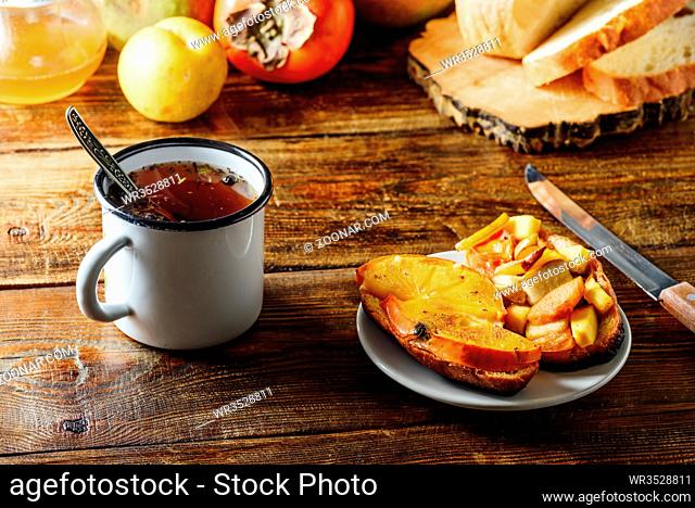 Fruit Bruschettas with Tea in Metal Mug with Ingredients on Background