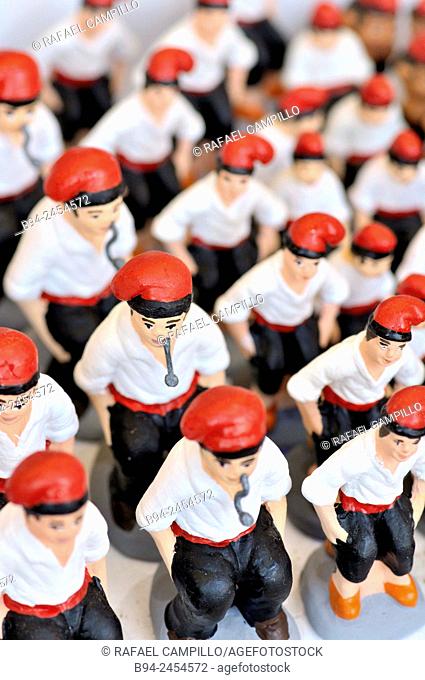 'Caganers', particular feature of modern nativity scenes at Santa Llucia Christmas fair, Barcelona. Catalonia, Spain