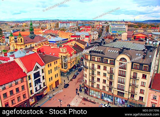 City panorama top view. Wonderful architecture of Ivano-Frankivsk. View of the Ukrainian city. Cityscape with white clouds. Modern exterior