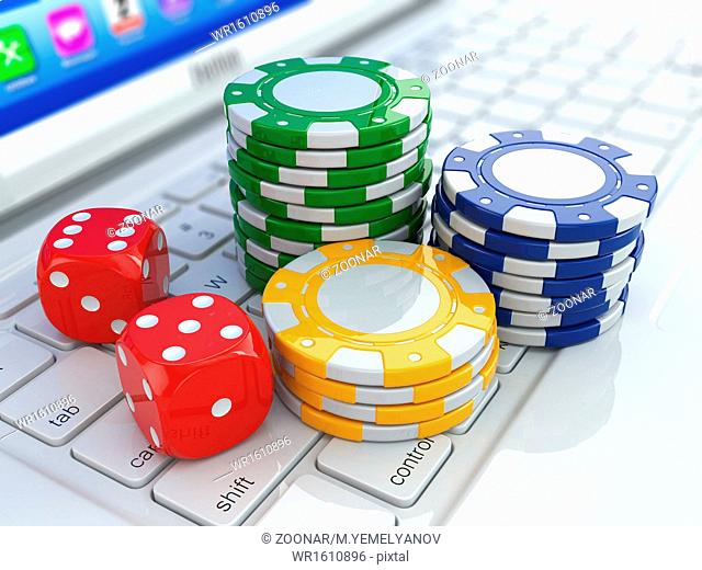 Online casino. Dices and chips on laptop