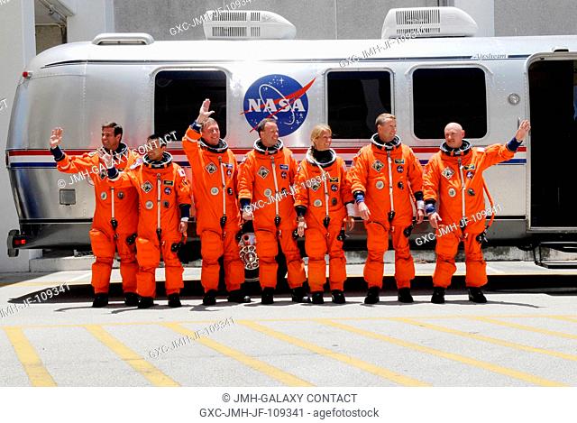 After suiting up, the STS-124 crewmembers pause alongside the Astrovan to wave farewell to onlookers before heading for launch pad 39A for the launch of Space...