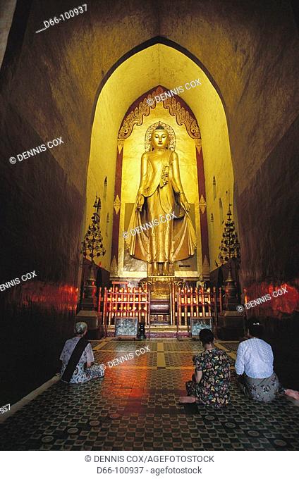 31 feet tall teak hovering Buddha in Ananda Temple, Bagan. Burma
