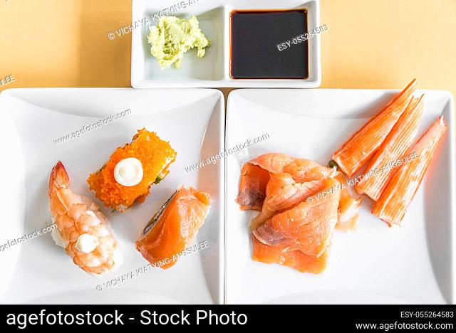 Sushi an sashimi in white dish