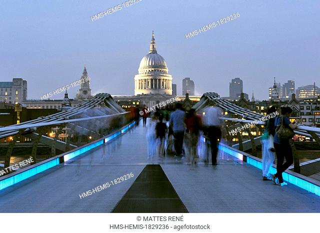 United Kingdom, London, Millenium Bridge by architect Norman Foster open in 2000 with the City in the background and St. Paul's Cathedral
