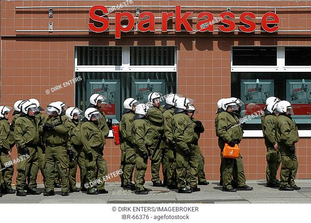 Policemen are waiting for service in front of a bank in Berlin