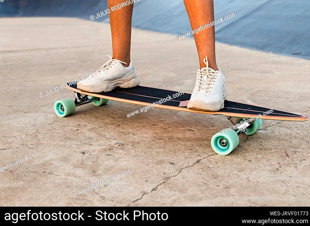 Woman skateboarding at park