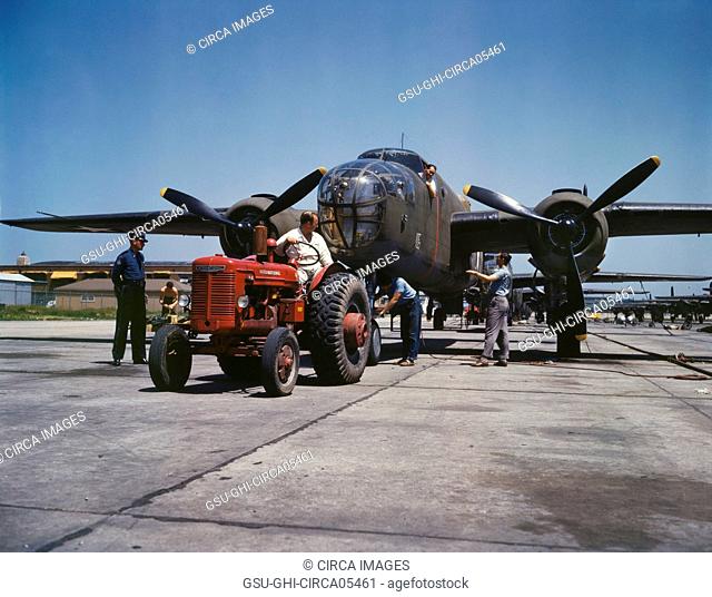 B-25 Bomber Planes Being Hauled along Outdoor Assembly Line by Tractor, North American Aviation, Inc., Kansas City, Kansas, USA, Alfred T