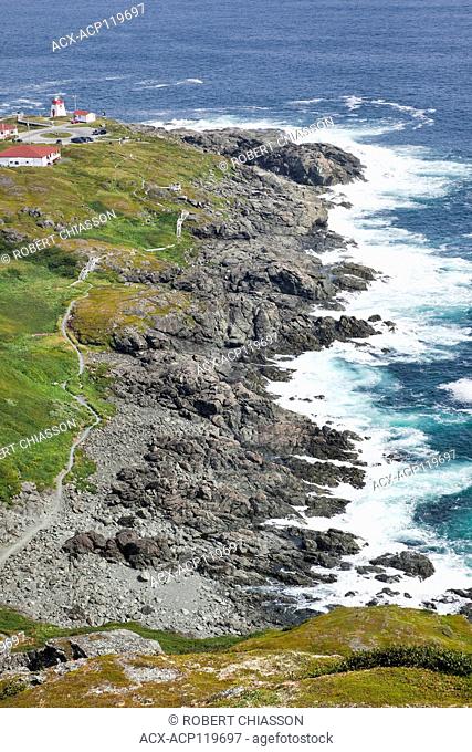 Rugged shoreline, trail and lighthouse at Fishing Point Municipal Park as seen from Daredevil Hill, St. Anthony, Newfoundland, Canada