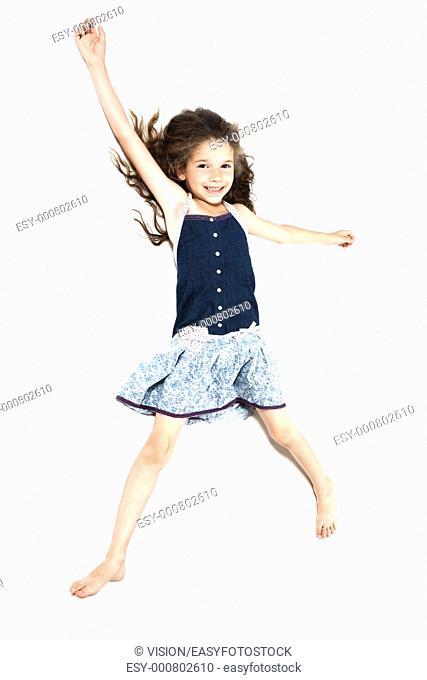 caucasian little girl laying happy isolated studio on white background