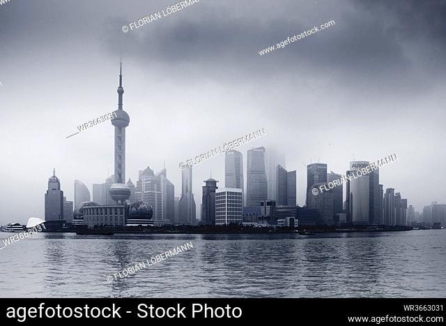 China, Shanghai, Financial District with dramatic sky