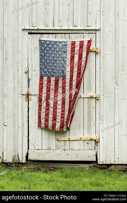 American flag hanging on barn door