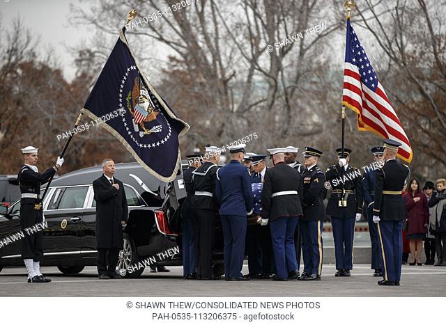 A joint service honor guard carries the casket of former US President George H.W. Bush out of the US Capitol in Washington, DC, USA, 05 December 2018