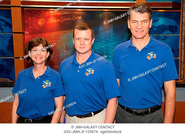 Russian cosmonaut Dmitry Kondratyev (center), Expedition 26 flight engineer and Expedition 27 commander; along with NASA astronaut Catherine Coleman and...