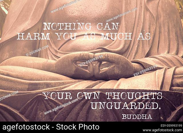 Nothing can harm you as much - famous Buddha quote printed on image of sculpture's hands in peaceful position, original photo id 37965439 is used