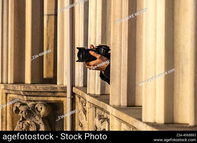 Tourist making pictures of the view from the 14th century Milan Cathedral (Duomo di Milano) in Milan, Italy, Europe