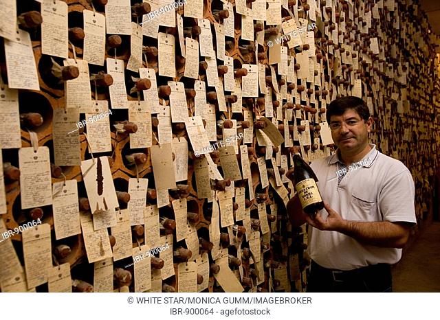 Oenologist, Oscar Gato, in the Bodega, wine store of sample bottles destined for export, Adega Cooperativa de Borba, Borba, Alentejo Region, Portugal, Europe