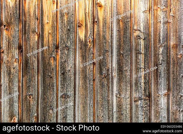 Closeup shot of brown, weathered wooden wall (background horizontal)