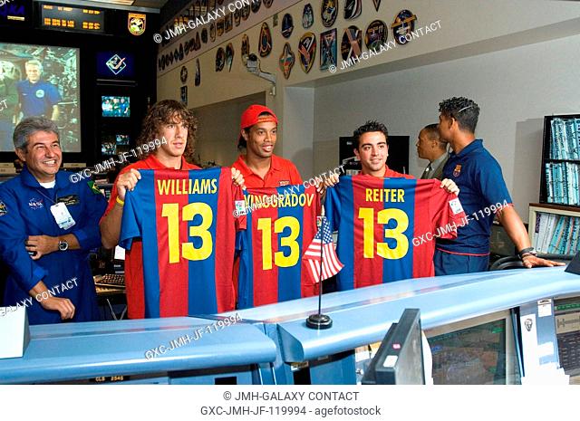 Members of the European champion soccer team, FC Barcelona, during a visit to NASA's Johnson Space Center, dropped by the Station (Blue) Flight Control Room in...