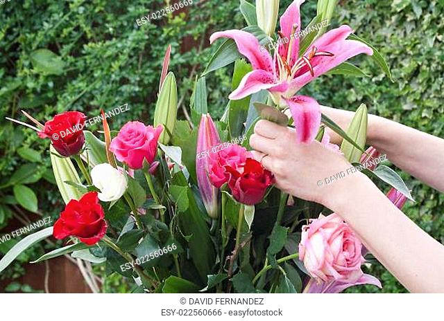 Woman arranging a bouquet of flowers