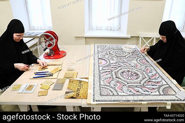 RUSSIA, YEKATERINBURG - DECEMBER 13, 2023: Nuns produce patterns at a mosaic workshop of Alexander Nevsky Novo-Tikhvinsky Convent. Donat Sorokin/TASS