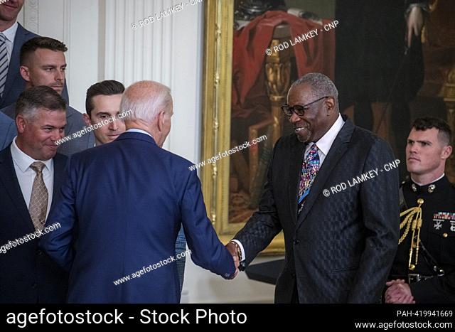 United States President Joe Biden shakes hands with Houston Astros Manager Duster Baker, right, as he welcomes the Houston Astros to the East Room of the White...