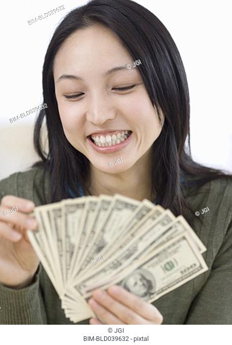 Asian woman counting money