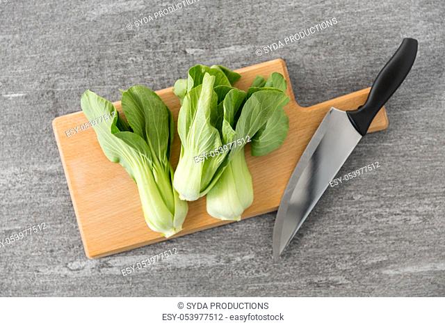 bok choy cabbage and knife on cutting board