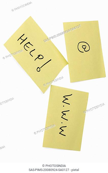 Help text and at symbol with www on adhesive notes