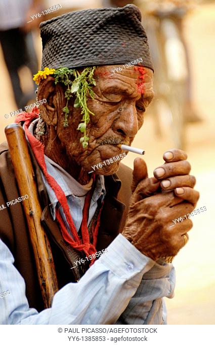 nepalis man smoking , the nepalis , life in kathmandu , kathmandu street life , nepal