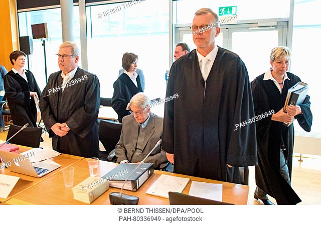 Defendant Reinhold Hanning (C) sits in the dock next to his lawyers Andreas Scharmer (L) and Johannes Salmen (R) as judge Anke Grudda enters the courtroom...