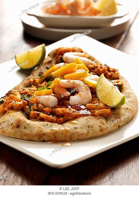 Naan bread with mango curry and prawns