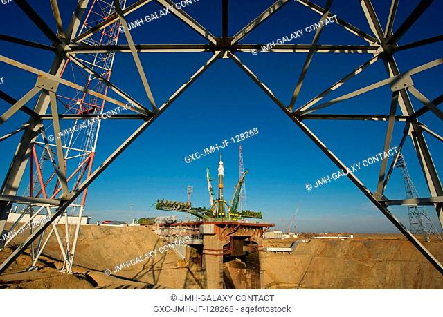 The Soyuz TMA-22 spacecraft is seen at the launch pad after being raised into vertical position on Friday, Nov. 11, 2011 at the Baikonur Cosmodrome in...