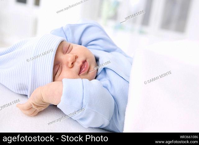 Baby girl (2 months) sleeping, portrait
